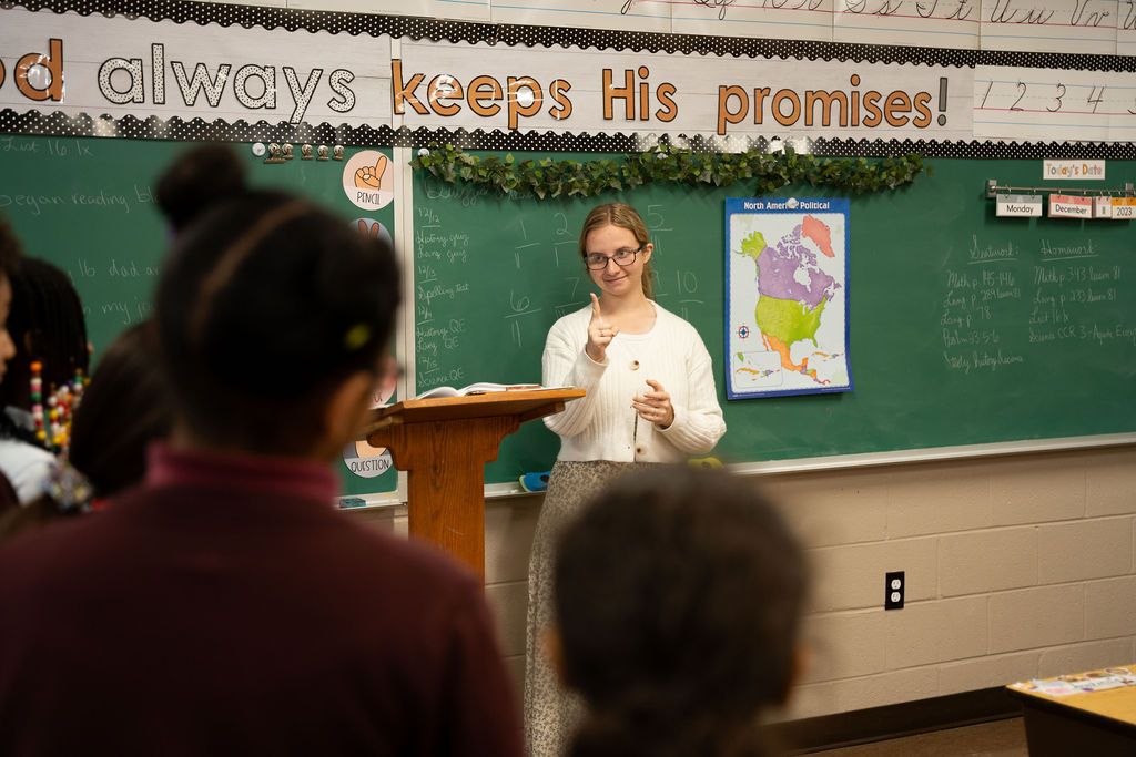 A teacher leads a lesson at the front of an IBA classroom